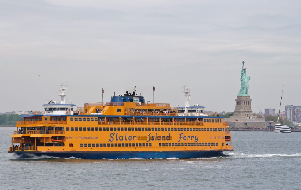 Staten Island Ferry in front of the Statue of Liberty