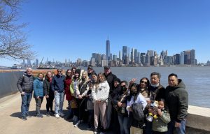 group photo in front of manhattan on liberty island